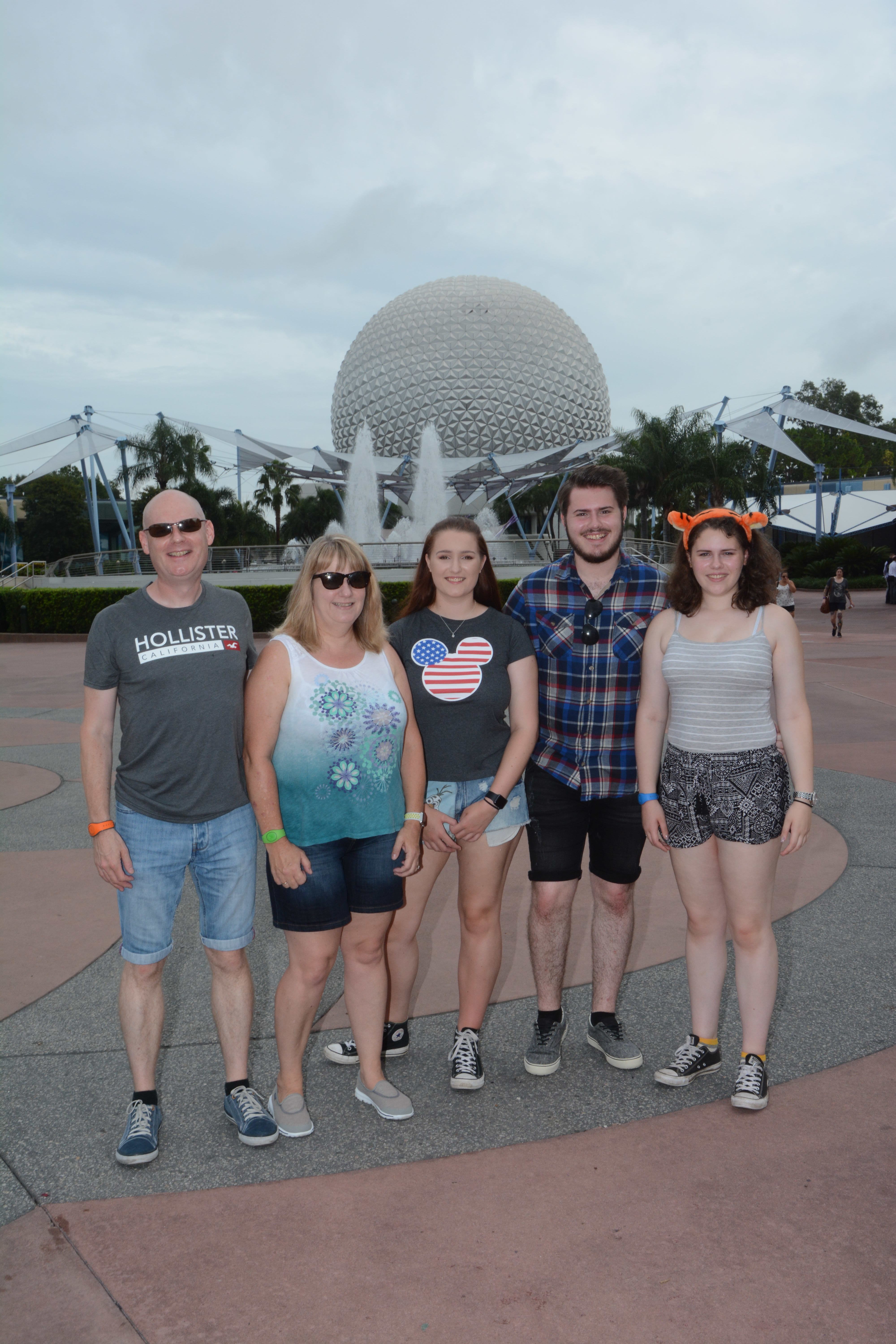 FAmily photopass photo infront of Spaceship Earth